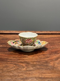 A Chinese Canton famille rose gilt-decorated cup and stand with flowers and butterflies, 19th C.