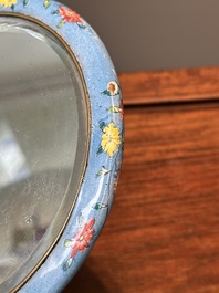 A Chinese Canton enamel circular hand mirror, early 19th C.