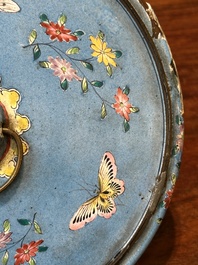 A Chinese Canton enamel circular hand mirror, early 19th C.