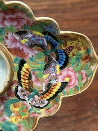 A Chinese Canton famille rose gilt-decorated cup and stand with flowers and butterflies, 19th C.
