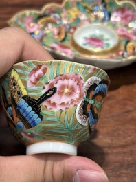 A Chinese Canton famille rose gilt-decorated cup and stand with flowers and butterflies, 19th C.