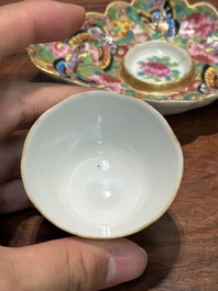 A Chinese Canton famille rose gilt-decorated cup and stand with flowers and butterflies, 19th C.