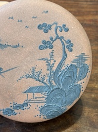 A Chinese blue-enameled Yixing stoneware box and cover with a mountainous landscape, 18/19th C.