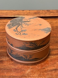 A Chinese blue-enameled Yixing stoneware box and cover with a mountainous landscape, 18/19th C.