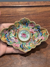 A Chinese Canton famille rose gilt-decorated cup and stand with flowers and butterflies, 19th C.