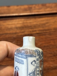 A Chinese blue, white and copper-red snuff bottle with inscription, 19th C.