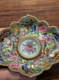 A Chinese Canton famille rose gilt-decorated cup and stand with flowers and butterflies, 19th C.