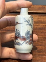 A Chinese blue, white and copper-red snuff bottle with inscription, 19th C.