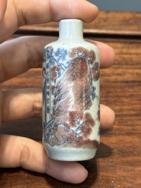 A Chinese blue, white and copper-red snuff bottle with inscription, 19th C.