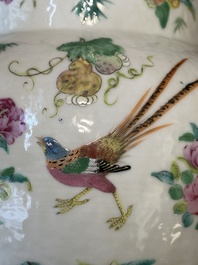 A pair of Chinese Canton famille rose spittoons with dragons, birds, butterflies and flowers, 19th C.