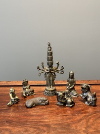 A collection of Chinese and Sino-tibetan bronze sculptures and paper weights, Qing