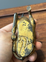 A group of four Chinese gilt bronze paper-weights, Ming/Qing