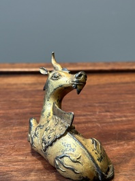 A group of four Chinese gilt bronze paper-weights, Ming/Qing