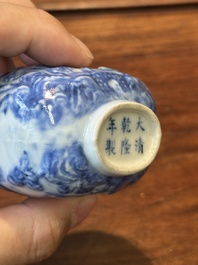 A Chinese blue and white snuff bottle and a famille rose openworked ball, 19th C.