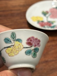 A pair of Chinese famille rose 'peony' cups and saucers, Yongzheng