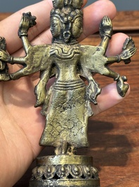 A collection of Chinese and Sino-tibetan bronze sculptures and paper weights, Qing