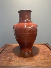 A Chinese monochrome red-glazed 'hu' vase, Qianlong mark, 19th C.