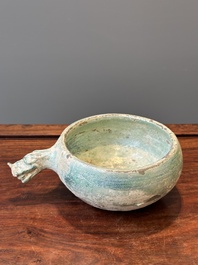 A Chinese monochrome green-glazed pottery scoop, Han