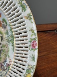 A Chinese Canton famille rose reticulated basket and stand, 19th C.