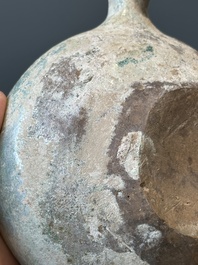 A Chinese monochrome green-glazed pottery scoop, Han