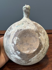 A Chinese monochrome green-glazed pottery scoop, Han