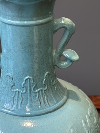 A Chinese monochrome turquoise-glazed vase with ruyi handles, Qianlong mark, 19/20th C.