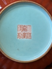 A Chinese coral-red-glazed gilt-decorated 'lotus scroll' saucer, Jiaqing mark, Republic