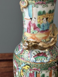 A Chinese Canton famille rose basin and a pair of vases with narrative design, 19th C.