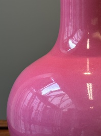 A Chinese monochrome ruby-pink-glazed 'tianqiuping' vase on wooden stand, Yongzheng mark, 19/20th C.