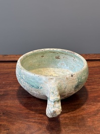 A Chinese monochrome green-glazed pottery scoop, Han