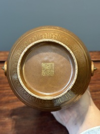 A Chinese brown-glazed 'hu' vase with gilt flower scrolls, Jiaqing mark and of the period