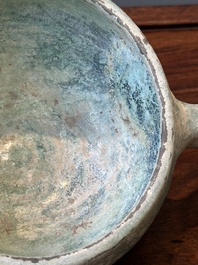 A Chinese monochrome green-glazed pottery scoop, Han