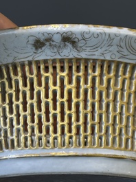 A Chinese Canton famille rose reticulated basket and stand, 19th C.