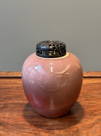 A Chinese monochrome copper-red-glazed ginger jar with a reticulated wooden cover, 18/19th C.