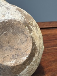 A Chinese monochrome green-glazed pottery scoop, Han
