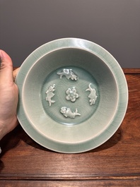 A Chinese Longquan celadon 'four carps' plate, Yuan or later