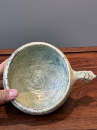 A Chinese monochrome green-glazed pottery scoop, Han