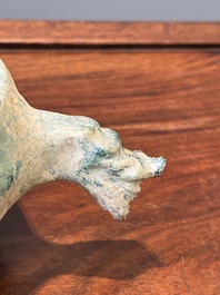 A Chinese monochrome green-glazed pottery scoop, Han
