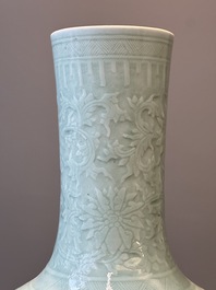 A pair of large Chinese monochrome celadon-glazed anhua 'lotus scroll' bottle vases, 19th C.