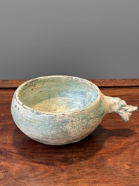 A Chinese monochrome green-glazed pottery scoop, Han