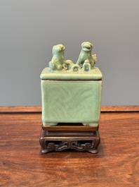 A Chinese Longquan celadon rectangular censer and cover on wooden stand, Ming