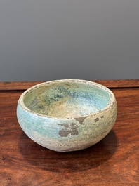 A Chinese monochrome green-glazed pottery scoop, Han