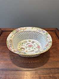 A Chinese Canton famille rose reticulated basket and stand, 19th C.