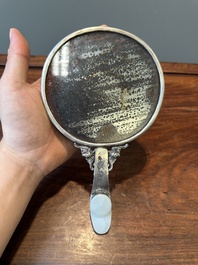 A Chinese white jade-mounted and gemstone inlaid silver hand mirror, 19/20th C.