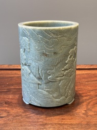 A Chinese spinach jade brush pot with relief design, 18th C.