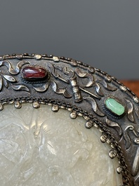 A Chinese white jade-mounted and gemstone inlaid silver hand mirror, 19/20th C.