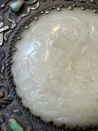 A Chinese white jade-mounted and gemstone inlaid silver hand mirror, 19/20th C.