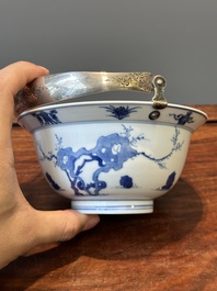 A Chinese blue and white bowl depicting playing boys and ladies with a mounted silver handle, Chenghua mark, Kangxi