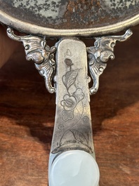 A Chinese white jade-mounted and gemstone inlaid silver hand mirror, 19/20th C.