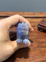 A group of Chinese carvings of lapis lazuli, pink quartz and other precious stones, with several stands, 19/20th C.